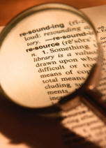 Photograph of a page from the dictionary with the word resource circled.
